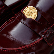 SANDRO PENNY LOAFER PIEL BURGUNDY